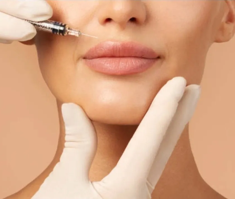 A cosmetic injection being administered to lips.