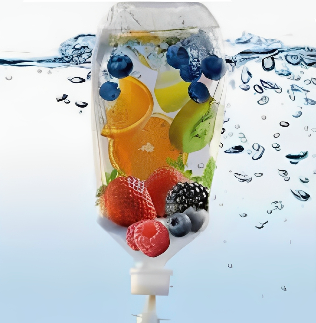 Infusion bottle with fresh fruits underwater creating vibrant bubbles.